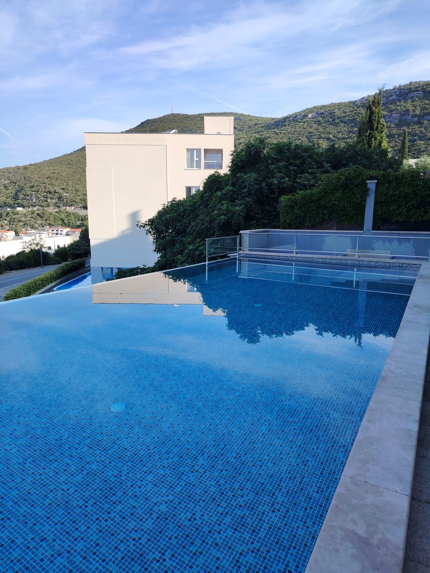 Pool deck with sea view at Hotel Stella